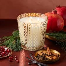 Photo of Holiday Candle in a decorative scene, designed by , available at Plumb Gold & Plumb Silver