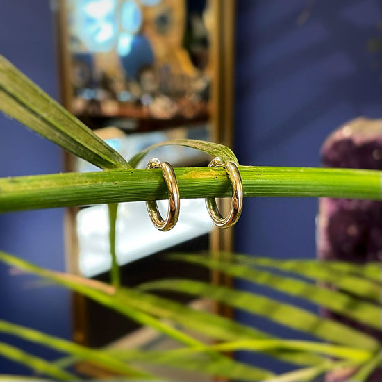 Photo of Hoop Earrings in a decorative scene, designed by , available at Plumb Gold & Plumb Silver