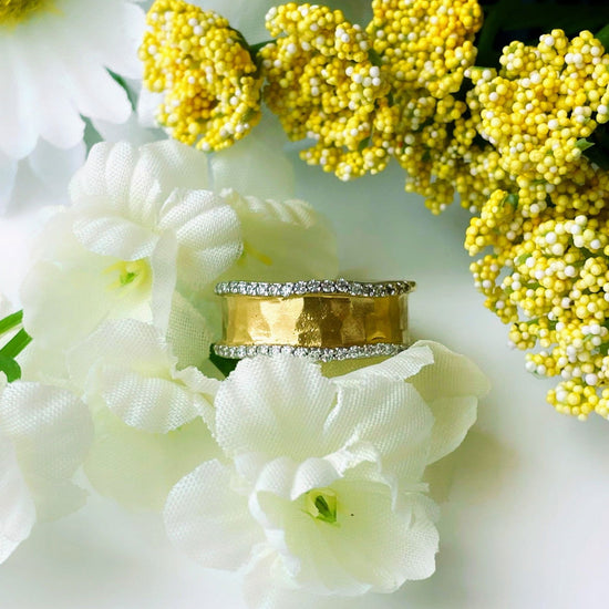 Photo of I.Reiss Diamond Gallery Ring in a decorative scene, designed by , available at Plumb Gold & Plumb Silver