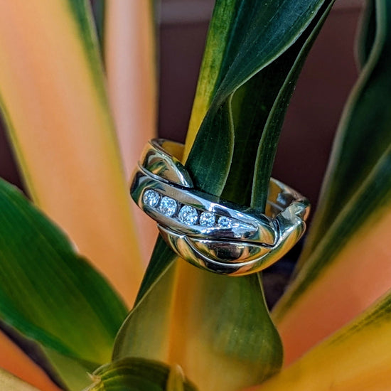Photo of "Inseparable" Ring in a decorative scene, designed by , available at Plumb Gold & Plumb Silver