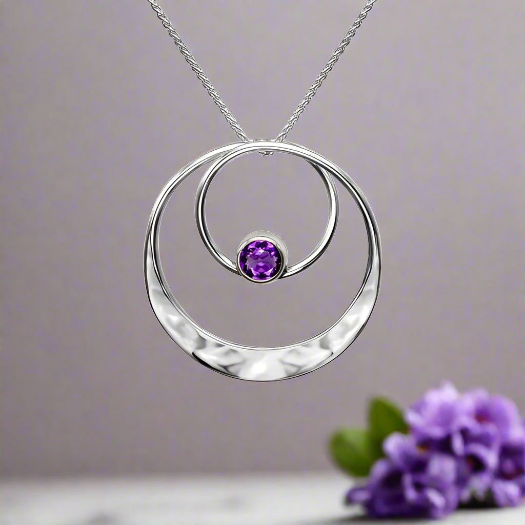 Photo of "Juliet" Amethyst Necklace in a decorative scene, designed by , available at Plumb Gold & Plumb Silver
