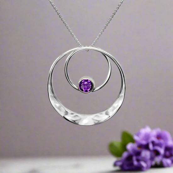 Photo of "Juliet" Amethyst Necklace in a decorative scene, designed by , available at Plumb Gold & Plumb Silver