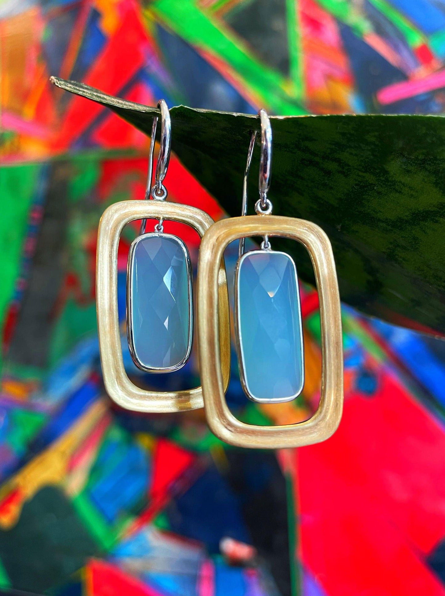 Photo of "Keops" Earrings in a decorative scene, designed by , available at Plumb Gold & Plumb Silver
