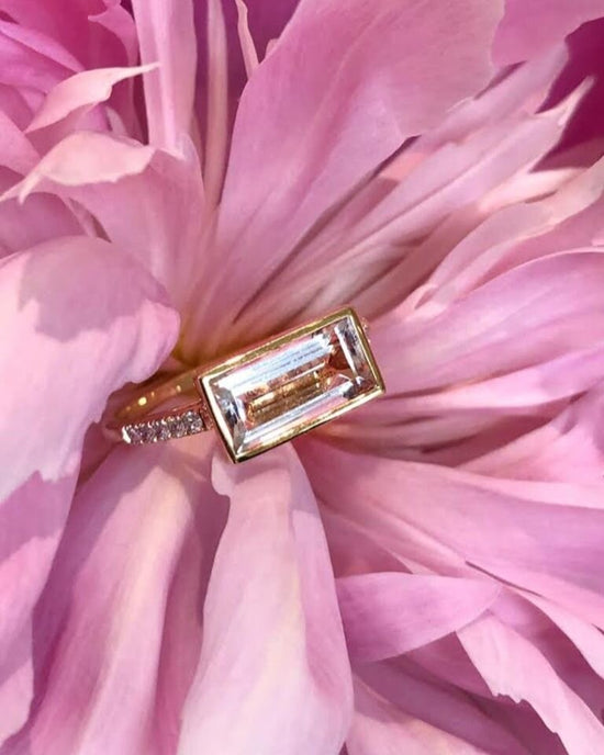 Photo of Kim Collins Horizontal Morganite Ring in a decorative scene, designed by , available at Plumb Gold & Plumb Silver