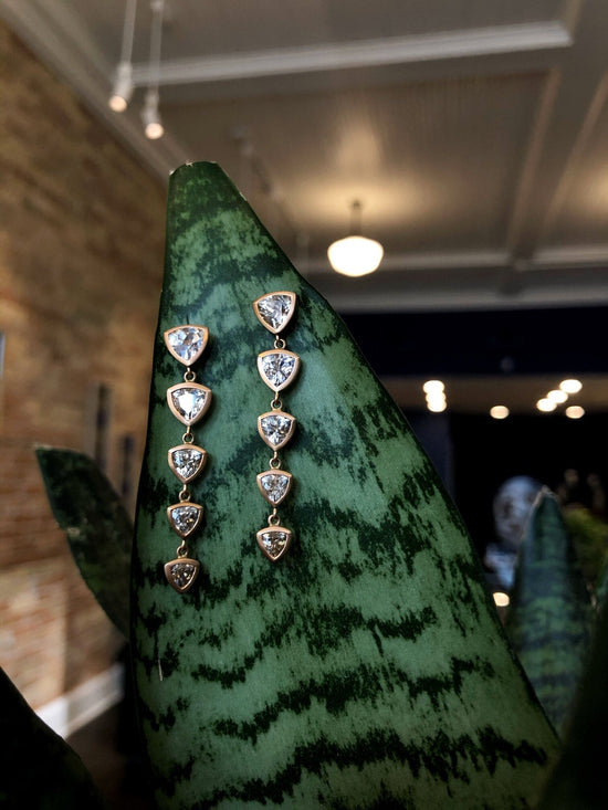 Photo of Kimberly Collins Champagne Zircon Dangles in a decorative scene, designed by , available at Plumb Gold & Plumb Silver