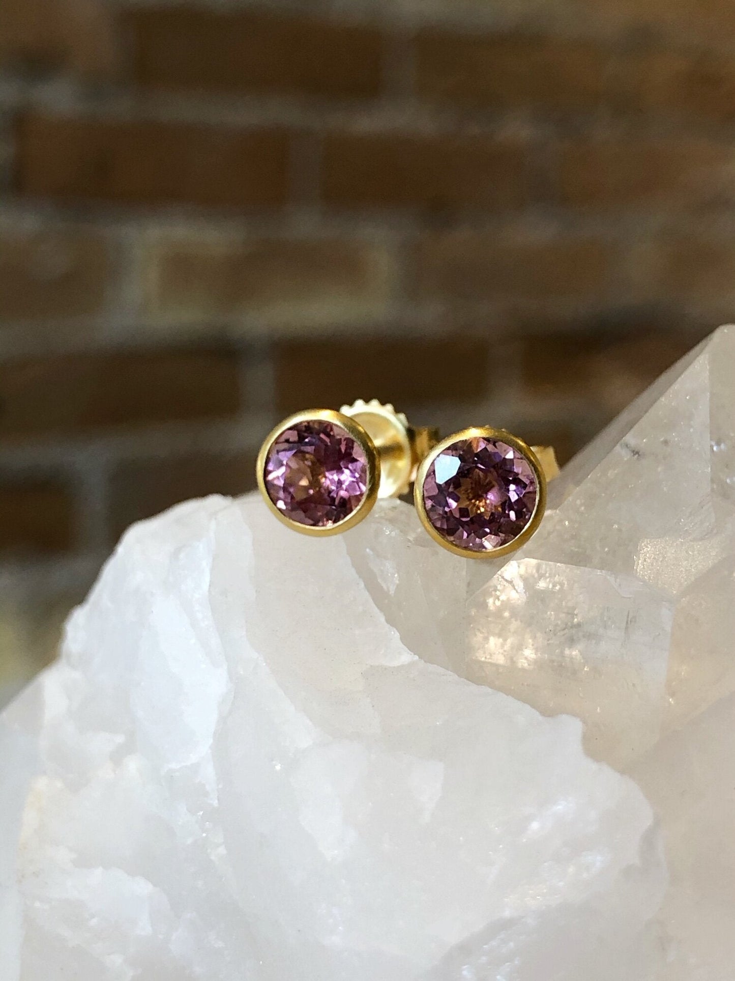 Photo of Kimberly Collins Pink Tourmaline Studs in a decorative scene, designed by , available at Plumb Gold & Plumb Silver