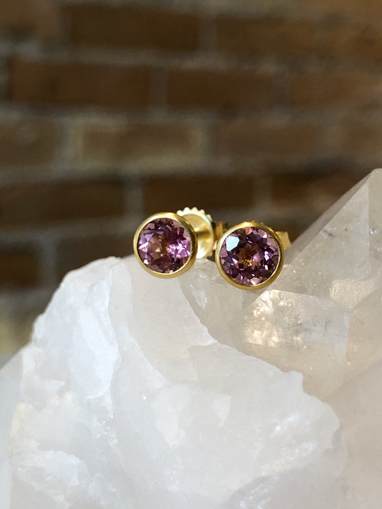 Photo of Kimberly Collins Pink Tourmaline Studs in a decorative scene, designed by , available at Plumb Gold & Plumb Silver