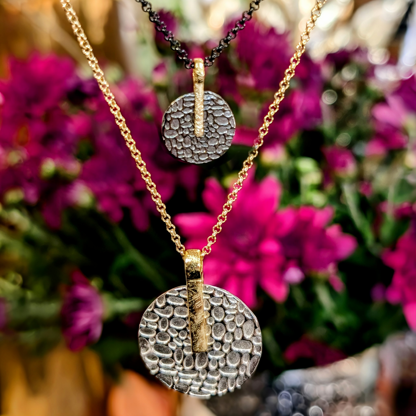 Photo of "Kymbal" pendant in a decorative scene, designed by -, available at Plumb Gold & Plumb Silver