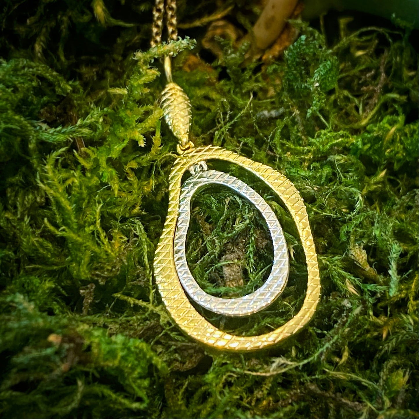 Photo of Lake Multi-Tone Pendant in a decorative scene, designed by -, available at Plumb Gold & Plumb Silver