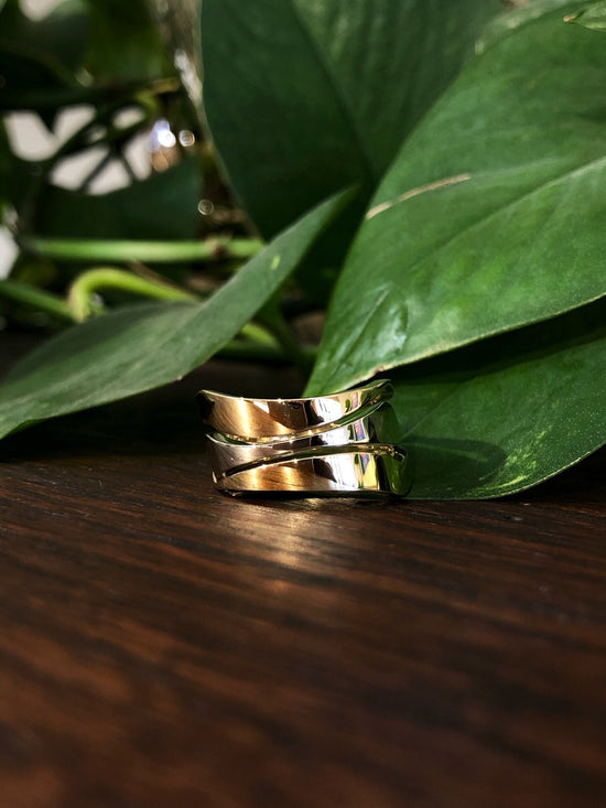 Photo of Large Freeform Ring in a decorative scene, designed by , available at Plumb Gold & Plumb Silver
