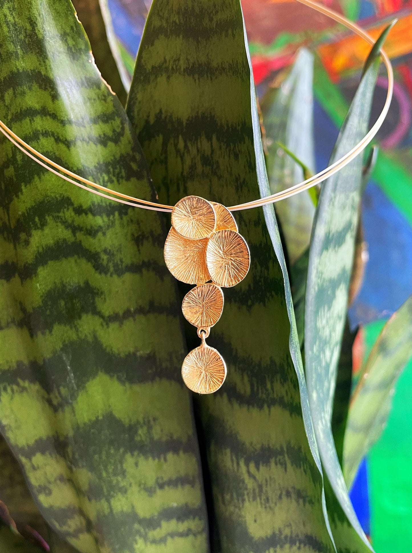 Photo of "Lily" Pendant in a decorative scene, designed by , available at Plumb Gold & Plumb Silver