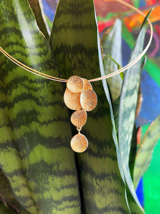 Photo of "Lily" Pendant in a decorative scene, designed by , available at Plumb Gold & Plumb Silver