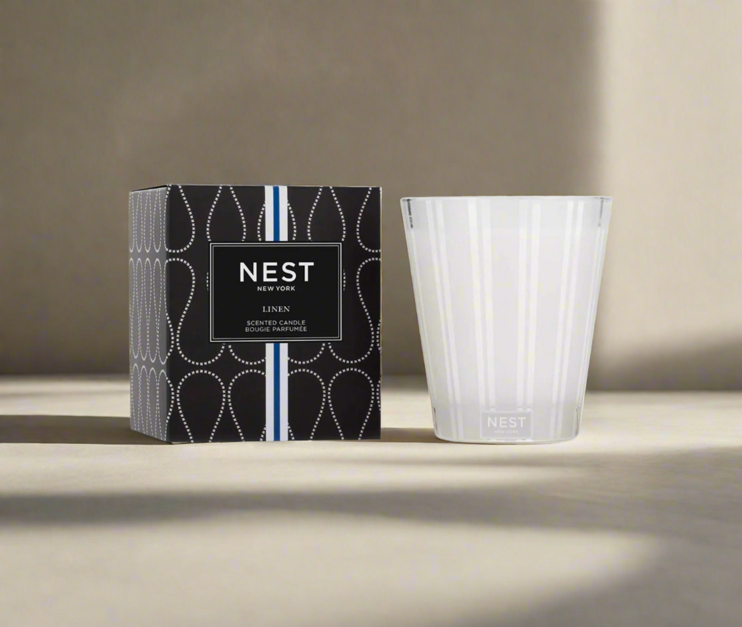 Photo of Linen Candle in a decorative scene, designed by , available at Plumb Gold & Plumb Silver
