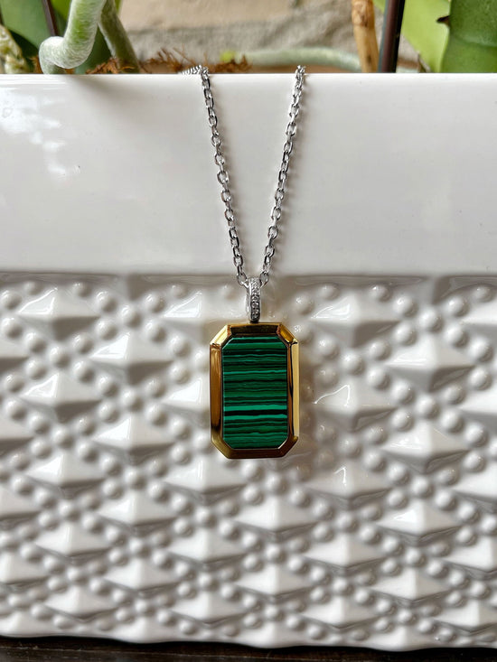 Photo of Malachite Locket in a decorative scene, designed by , available at Plumb Gold & Plumb Silver