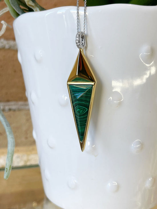 Photo of Malachite and Cubic Zirconia Necklace in a decorative scene, designed by , available at Plumb Gold & Plumb Silver