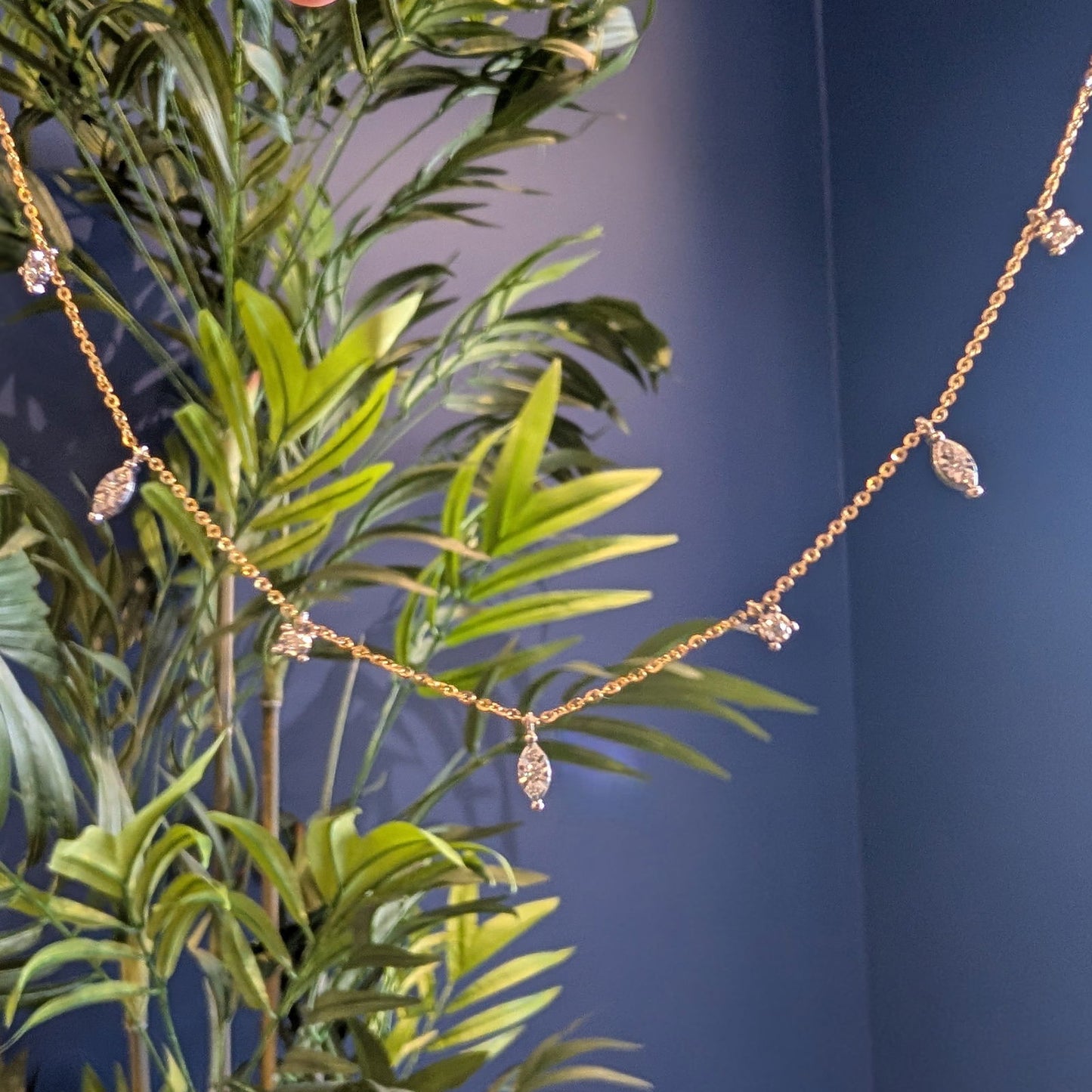 Photo of Marquesa Necklace in a decorative scene, designed by -, available at Plumb Gold & Plumb Silver