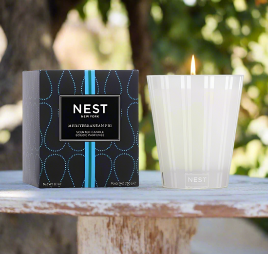 Photo of Mediterranean Fig Candle in a decorative scene, designed by , available at Plumb Gold & Plumb Silver
