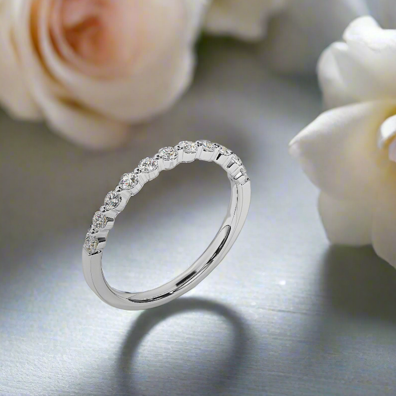 Photo of "Mira" band in a decorative scene, designed by , available at Plumb Gold & Plumb Silver