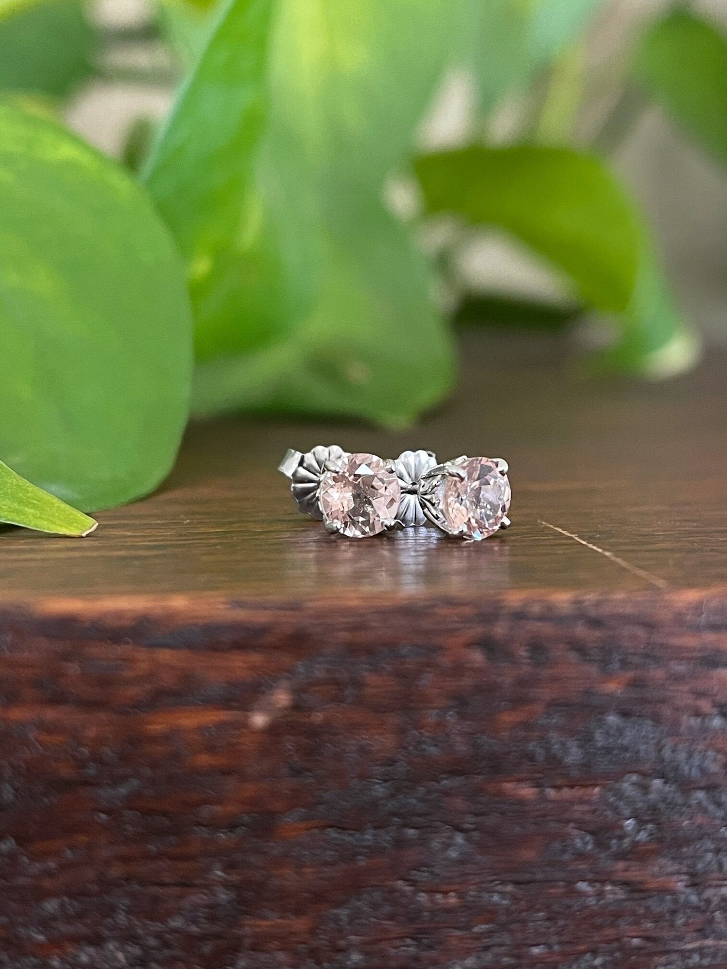 Photo of Morganite Studs in a decorative scene, designed by , available at Plumb Gold & Plumb Silver
