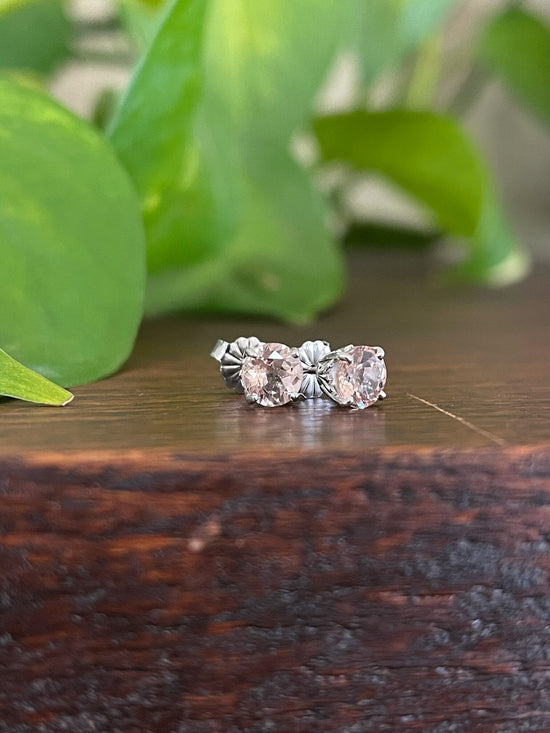 Photo of Morganite Studs in a decorative scene, designed by , available at Plumb Gold & Plumb Silver