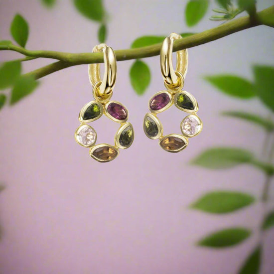 Photo of "Morning" Tourmaline Earrings in a decorative scene, designed by -, available at Plumb Gold & Plumb Silver