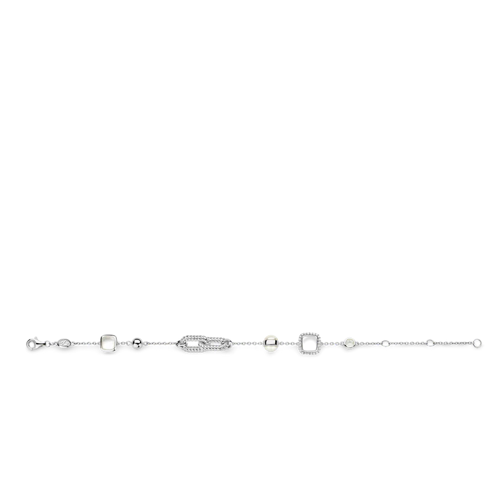 Photo of Mother Of Pearl Geo Station Bracelet in a decorative scene, designed by , available at Plumb Gold & Plumb Silver