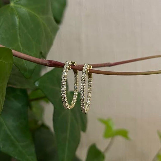 Photo of Naledi Collection Paloma Diamond Hoops in a decorative scene, designed by , available at Plumb Gold & Plumb Silver