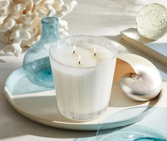Photo of Ocean Mist & Sea Salt Candle in a decorative scene, designed by , available at Plumb Gold & Plumb Silver