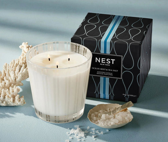 Photo of Ocean Mist & Sea Salt Candle in a decorative scene, designed by , available at Plumb Gold & Plumb Silver