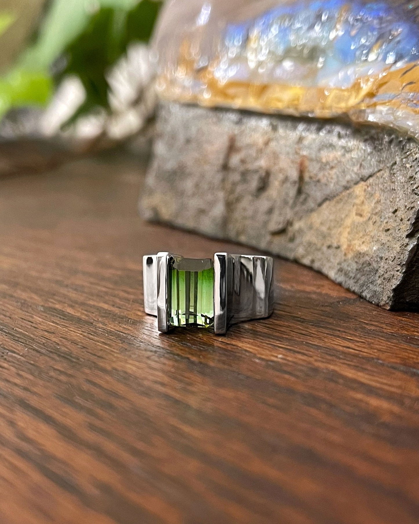 Photo of Ombre Tourmaline Ring in a decorative scene, designed by , available at Plumb Gold & Plumb Silver