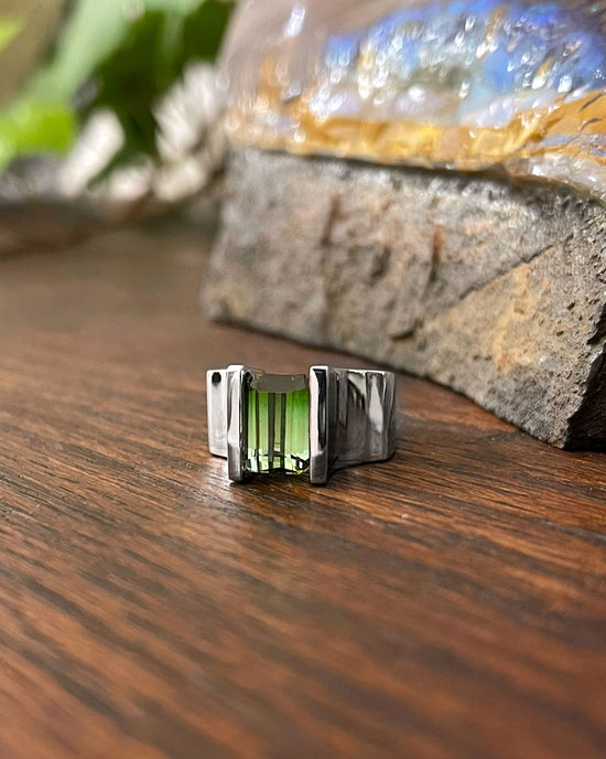 Photo of Ombre Tourmaline Ring in a decorative scene, designed by , available at Plumb Gold & Plumb Silver