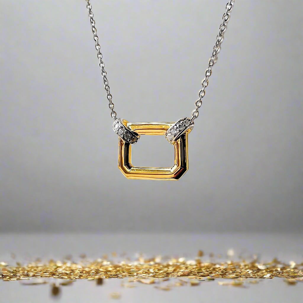 Photo of Open Shape Necklace in a decorative scene, designed by , available at Plumb Gold & Plumb Silver