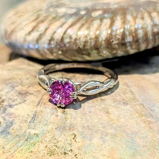 Photo of "Pamela" Pink Sapphire in a decorative scene, designed by , available at Plumb Gold & Plumb Silver