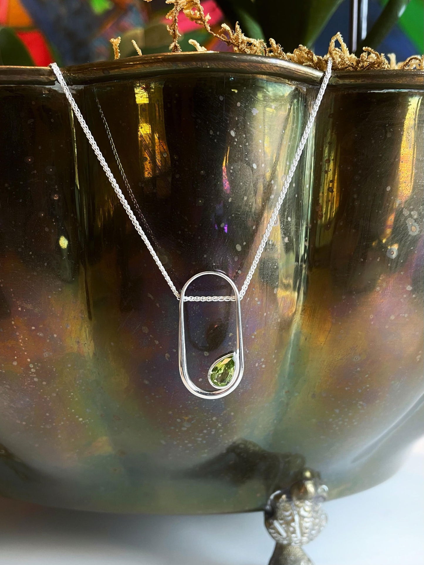 Photo of "Paragon" Pendant in a decorative scene, designed by , available at Plumb Gold & Plumb Silver