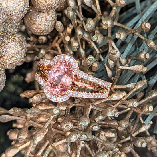 Photo of Peach Garnet Ring in a decorative scene, designed by , available at Plumb Gold & Plumb Silver