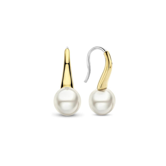 Photo of Pearl Drop Earrings in a decorative scene, designed by , available at Plumb Gold & Plumb Silver