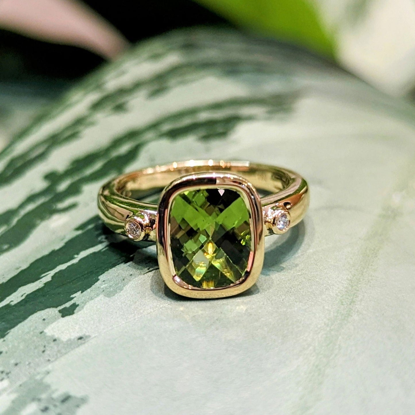 Photo of Peridot Ring in a decorative scene, designed by , available at Plumb Gold & Plumb Silver