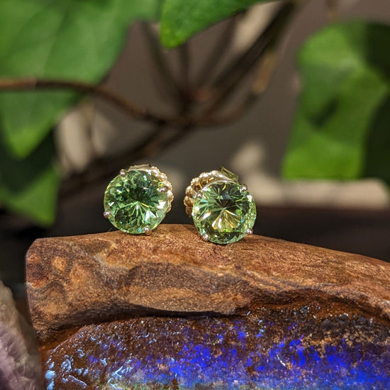 Photo of Peridot Studs in a decorative scene, designed by , available at Plumb Gold & Plumb Silver