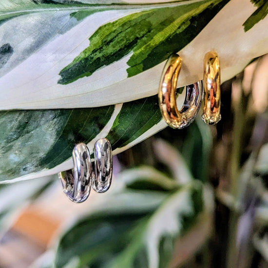Photo of Petite Classic Hoops in a decorative scene, designed by , available at Plumb Gold & Plumb Silver