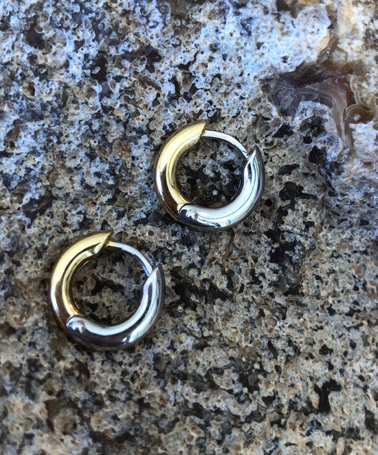 Photo of Petite Classic Hoops in a decorative scene, designed by , available at Plumb Gold & Plumb Silver