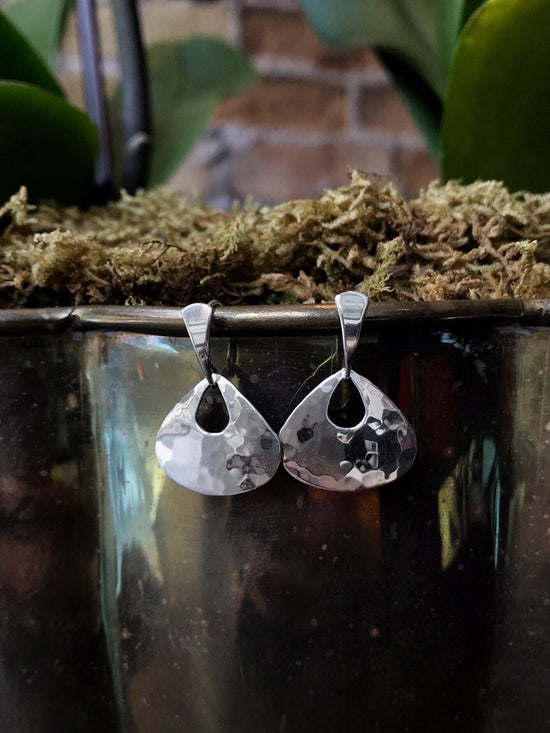 Photo of "Petite Jamaica" Earrings in a decorative scene, designed by , available at Plumb Gold & Plumb Silver