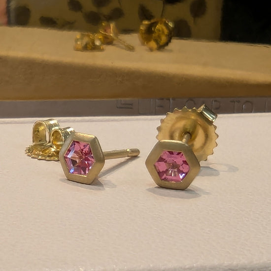 Load image into Gallery viewer, Photo of Pink Spinel Hex Studs in a decorative scene, designed by , available at Plumb Gold &amp;amp; Plumb Silver
