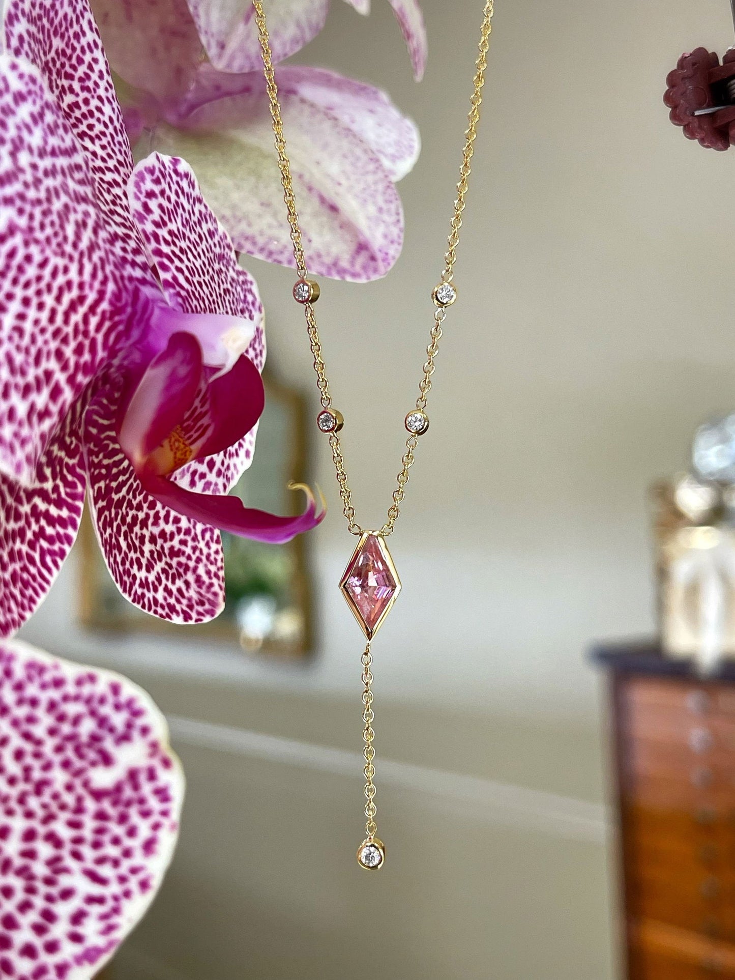 Photo of Pink Tourmaline Necklace in a decorative scene, designed by , available at Plumb Gold & Plumb Silver