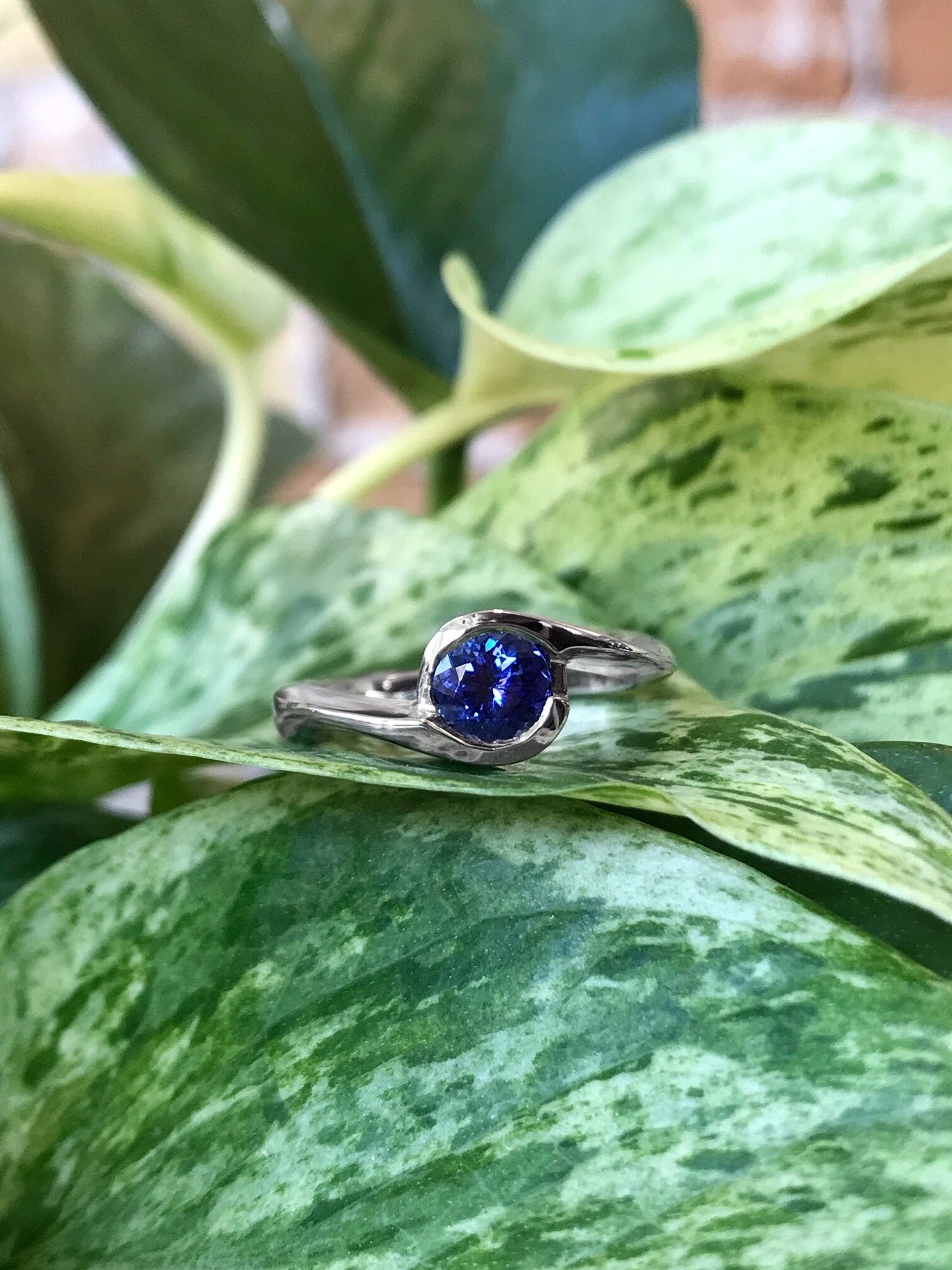 Photo of Plumb Gold Legacy Tanzanite Ring in a decorative scene, designed by , available at Plumb Gold & Plumb Silver