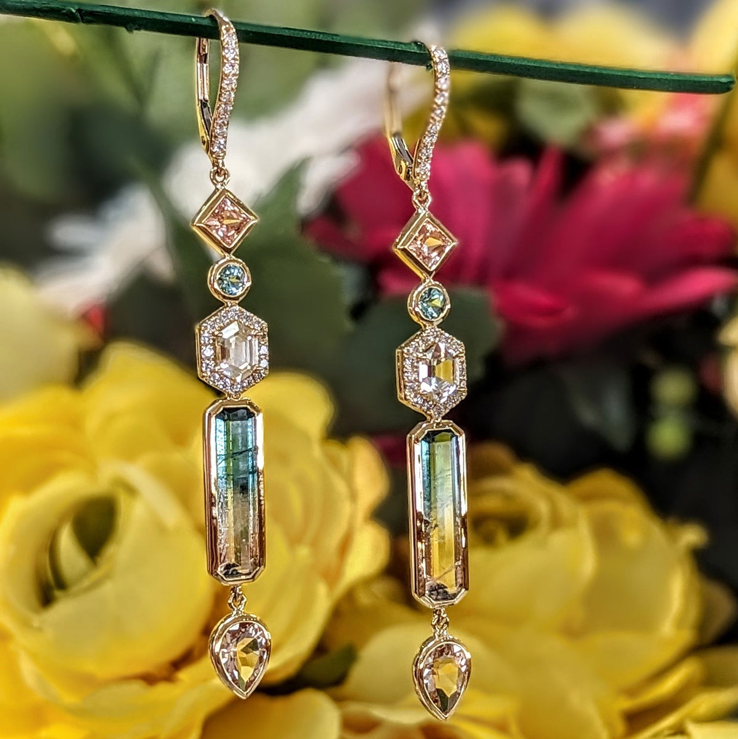 Photo of Plumb Gold Original Multi-Gem Dangle Earrings in a decorative scene, designed by , available at Plumb Gold & Plumb Silver