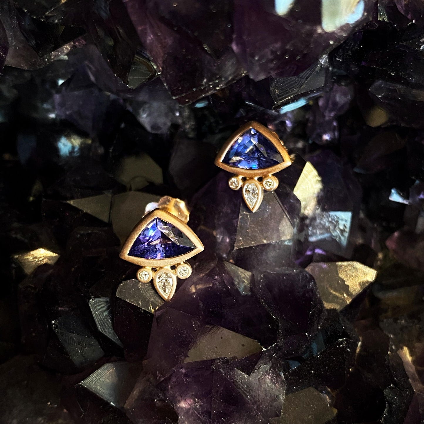 Photo of Plumb Gold Original Tanzanite and Diamond "Fan" Earring in a decorative scene, designed by , available at Plumb Gold & Plumb Silver