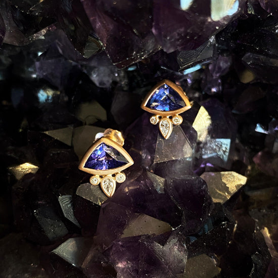 Photo of Plumb Gold Original Tanzanite and Diamond "Fan" Earring in a decorative scene, designed by , available at Plumb Gold & Plumb Silver