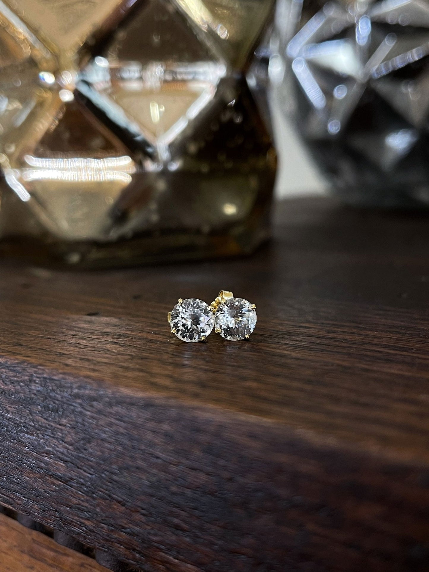 Photo of Plumb Gold Original White Zircon Studs in a decorative scene, designed by , available at Plumb Gold & Plumb Silver