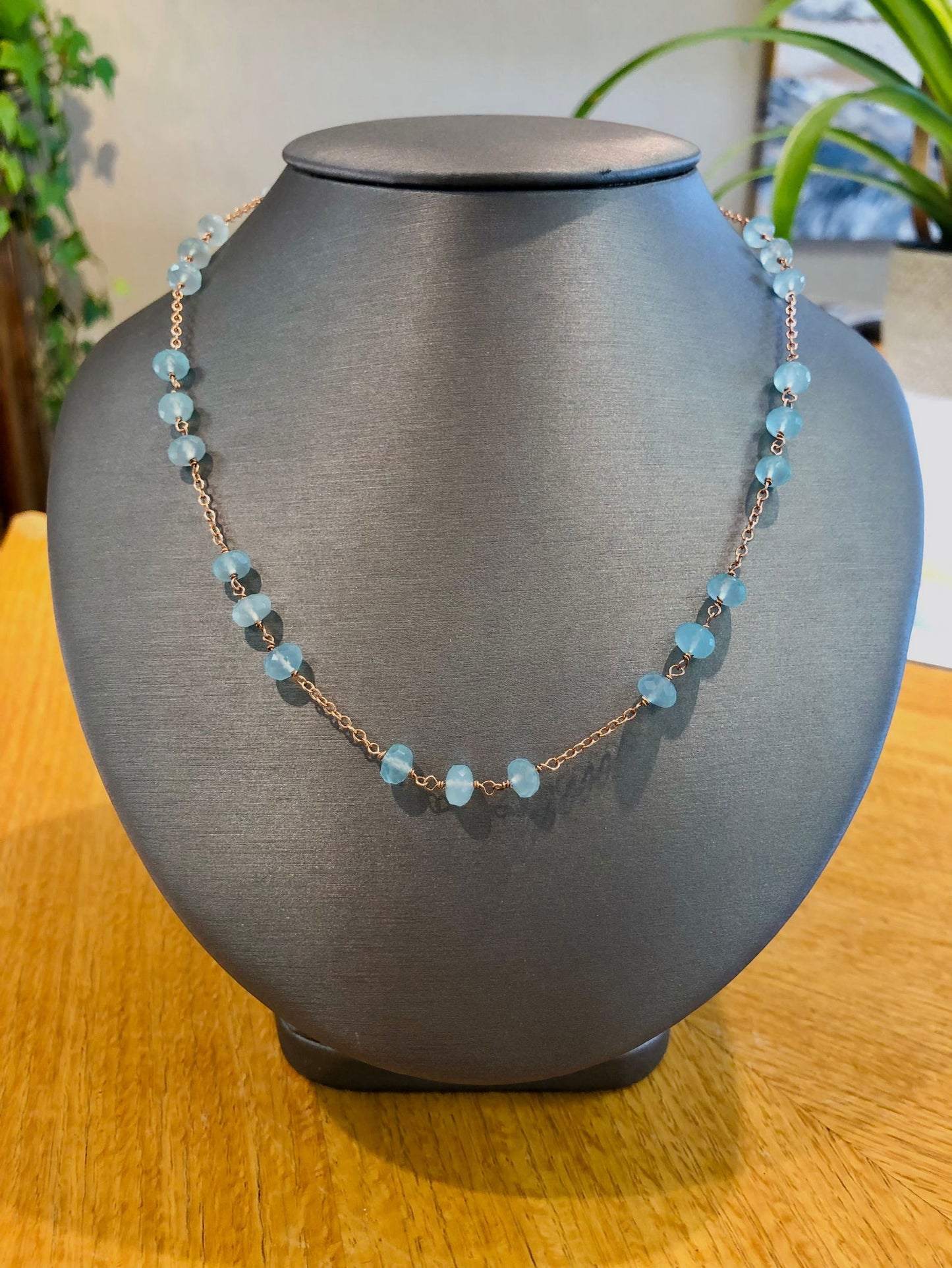 Photo of Plumb Silver Original Blue Apatite Necklace in a decorative scene, designed by , available at Plumb Gold & Plumb Silver