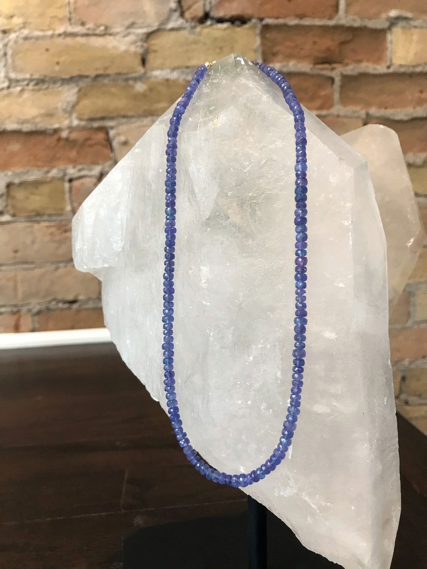 Photo of Plumb Silver Original Tanzanite Necklace in a decorative scene, designed by , available at Plumb Gold & Plumb Silver